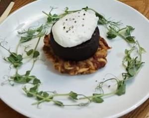 a white plate with a dessert on a table at The Herdwick Inn in Penruddock