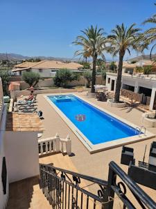 a view of a swimming pool from a balcony at Cortijo La Cueva in Arboleas