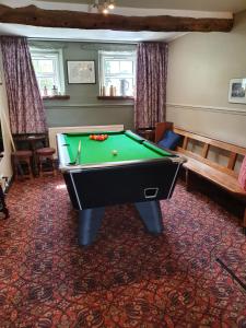 a billiard room with a pool table in it at The Herdwick Inn in Penruddock