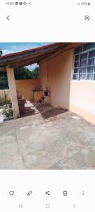 a picture of a house with a garage at Pousada Paraíso Pedacinho Do Céu 2 in Águas de Lindóia +2 photos