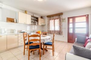 a kitchen and dining room with a table and chairs at House Ivana in Blato +11 photos