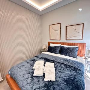 a bedroom with a bed with two pillows on it at Central Luxury Apartment Maison De Luxx A10 in Larisa +8 photos