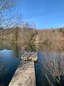a dock on a body of water at domaine des planesses in Ferdrupt