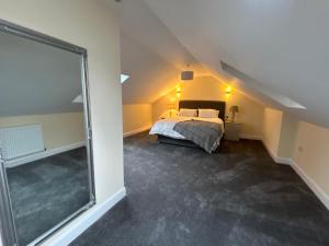 a bedroom with a bed and a large glass window at Four Bedroom House With Private Pool - Stunning countryside location with parking close to Chester City Centre in Chester +43 photos