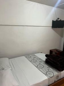Postel nebo postele na pokoji v ubytování Hostal Casa Primavera