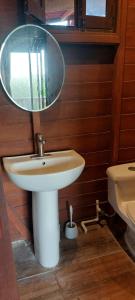 a bathroom with a sink and a mirror at Cabaña Punta Cocos in Holbox Island