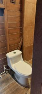 a bathroom with a toilet in a room at Cabaña Punta Cocos in Holbox Island +2 photos