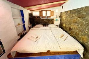 Posteľ alebo postele v izbe v ubytovaní Cinco Lunas VEGETARIAN Guesthouse + 37 fotografií