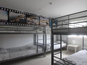 Postel nebo postele na pokoji v ubytování Zambeachouse - Hostel Paradise