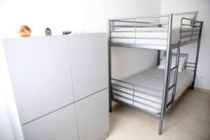 Postel nebo postele na pokoji v ubytování Zambeachouse - Hostel Paradise