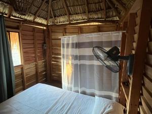 a bedroom with a bed and a net curtain at Sandollar in León +17 photos