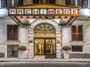 a store front of a hotel with a sign over the door at Raeli Hotel Archimede in Rome