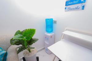 מיטה או מיטות בחדר ב-Dhahabu private Apartment
