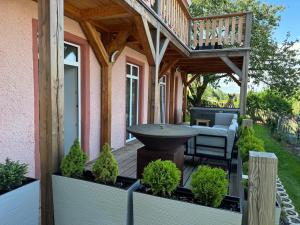 a porch with a sink and a wooden deck at Apartmán Horský Sklípek in Trutnov