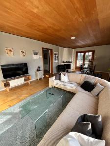a living room with a couch and a table at Big room in Charming Guest House in Oslo City 5 in Oslo