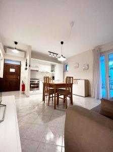 a kitchen and dining room with a table and chairs at Apartment in Funtana - Istrien 53415 in Funtana