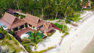 an aerial view of a resort on the beach at Sun and Sand Beachfront Pool Villa in Koh Phangan