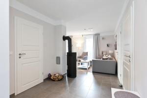 a living room with a fireplace and a couch at unter den Kiefern 98 EG in Marienfelde