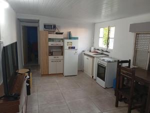 a kitchen with a white refrigerator and a stove at Sofía in Dolores