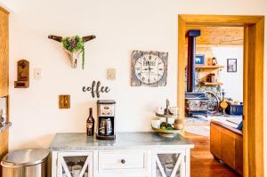 a kitchen with a counter and a clock on the wall at Alpine Highmark in Alpine