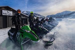 a group of people on motorcycles in the snow at Alpine Highmark in Alpine