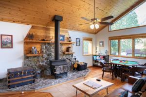a living room with a fireplace and a table at Alpine Highmark in Alpine +39 photos
