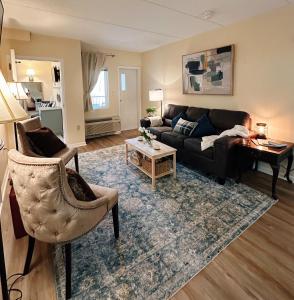 a living room with a couch and a table at Smoky Hue in Gatlinburg