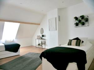 Postel nebo postele na pokoji v ubytování Villa à 1h15 de Paris, avec Piscine, Spa & Sauna + 49 fotografií