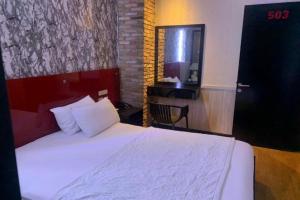 Postel nebo postele na pokoji v ubytování Gia Huyền Hotel