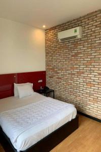 Postel nebo postele na pokoji v ubytování Gia Huyền Hotel