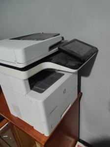 two printers sitting on top of a wooden shelf at Bruma in Papalotla