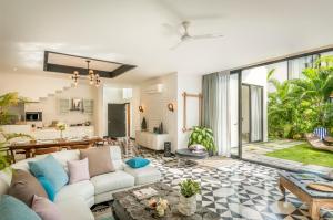 a living room with a couch and a table at Casa, Anjuna villa Vagator, with Pvt pool in Vagator