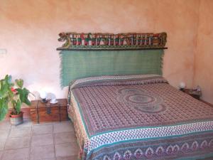 Letto o letti in una camera di Agriturismo QuartoPodere