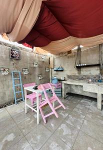 Kuchyň nebo kuchyňský kout v ubytování D'Flora Homestay