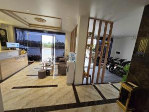 a lobby with a door open to a room with motorcycles at Rosy Hotel 6 in Hanoi