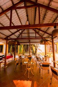 a pavilion with tables and chairs in a room at Hoi An Phu Quoc Resort & Spa in Phu Quoc
