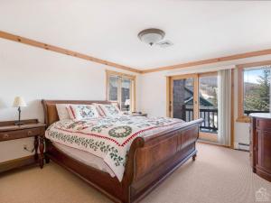a bedroom with a bed and a window at Wintertime in Windham