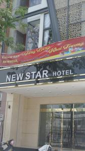 a new star hotel sign on top of a building at New Star Hotel Tay Ninh in Ấp Bình Trung