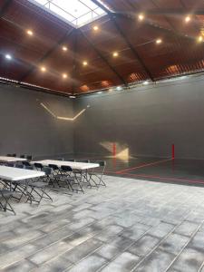a large room with tables and chairs in it at Casa las palmerasmeras in Chalco de Díaz Covarrubias
