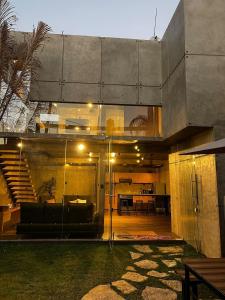 a modern house with a living room and a staircase at Casa las palmerasmeras in Chalco de Díaz Covarrubias +10 photos