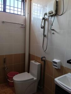 a bathroom with a toilet and a shower at Luxurious Noble Homestay in Sungai Petani +21 photos