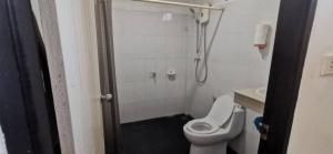 a bathroom with a shower with a toilet and a sink at Little Purple House 2- AoNang in Ao Nang  +15 photos