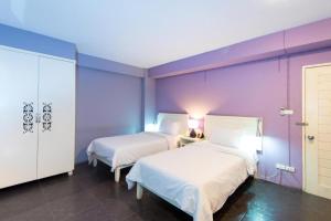 Postel nebo postele na pokoji v ubytování Lilac Relax-Residence