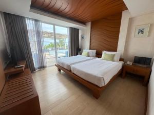 Postel nebo postele na pokoji v ubytování Tusita Wellness Resort + 37 fotografií