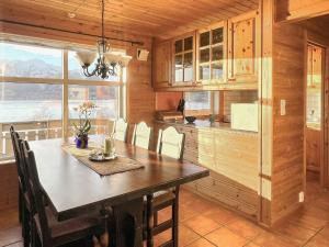 a dining room with a table and chairs in a kitchen at 6 person holiday home in Leikanger in Leikanger