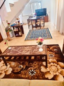 a living room with a table and a dining room at Dwarka By Natures Sweet Homes in Panchgani