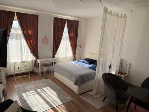 Postel nebo postele na pokoji v ubytování Apartmány v pivovaru