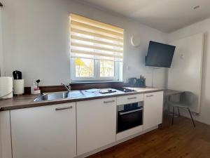 Η κουζίνα ή μικρή κουζίνα στο ma suite - smart apartment 2P - city Center +3 φωτογραφίες