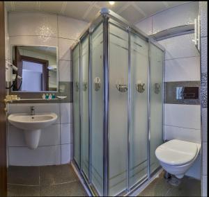 a bathroom with a toilet and a sink at Kuran Hotel International in Istanbul +71 photos