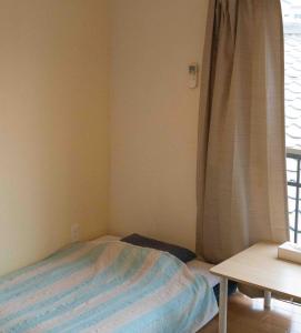 Postel nebo postele na pokoji v ubytování Guesthouse Matsuo B